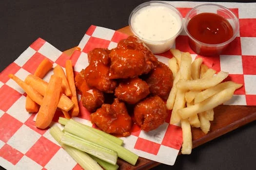 crispy buffalo wings with hot sauce